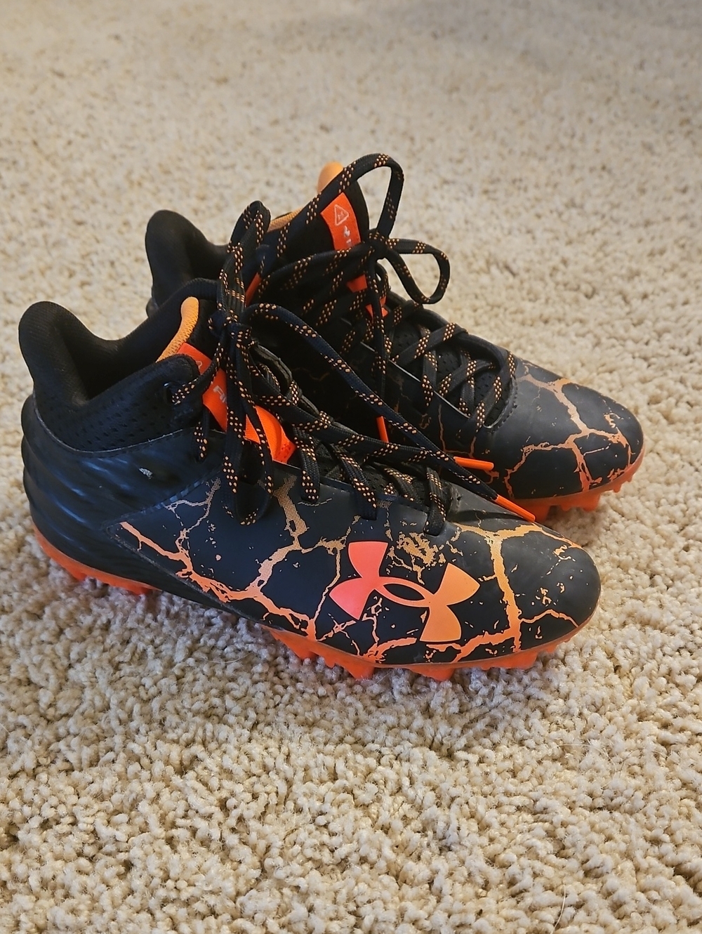 Under Armour Kids Black and Orange Fire Cleats